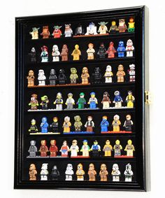 a display case filled with lots of lego minifigure action figures on black shelves