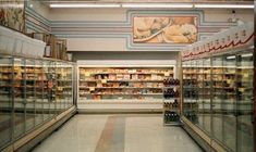 an empty grocery store filled with lots of bottles