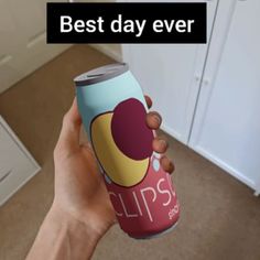 a person holding up a cup with the words best day ever on it