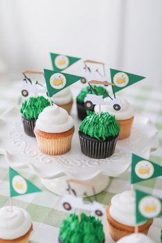 cupcakes decorated with green frosting and flags