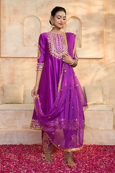 Purple anarkali in dupion base with floral pattern gota embroidered yoke, cuffs, hem and fringed lace details. Comes with matching dupion salwar and dupatta. - Aza Fashions Semi-stitched Raw Silk Dress With Gota Work, Semi-stitched Slub Silk Lehenga With Gota Work, Anarkali Chanderi Palazzo Set With Gota Work, Purple Raw Silk Kurta With Resham Embroidery, Festive Chanderi Dress With Gota Work, Traditional Drape Raw Silk Dress With Gota Work, Anarkali Purple Raw Silk Set, Festive Raw Silk Dress With Gota Work, Purple Anarkali Set In Raw Silk