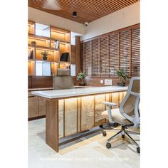 an office desk with a chair in front of it