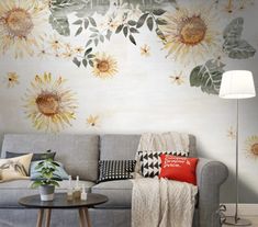 a living room with sunflowers painted on the wall