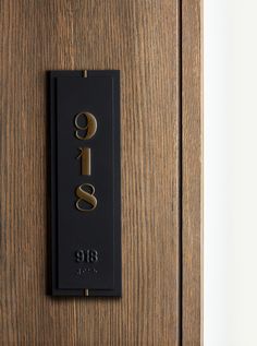 the door is made of wood and has a sign on it that says g & s