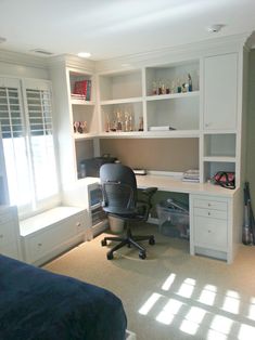 a bedroom with a bed, desk and shelves