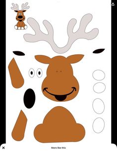 the paper cut out of a reindeer with eyes and antlers