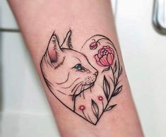 a tattoo on the arm of a woman with a dog's head and flowers