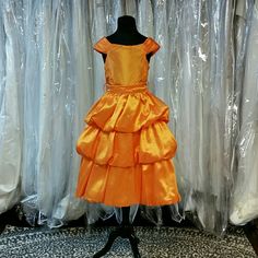 As Bright As Sunshine, This Dress Is Stunning In Design And Color. Featuring Pleated Shoulder Straps, Zipper Back, Plain Bodice With An Open Poofy Tiered Skirt, And Removable Tie Waist Band. Designer: La Sandra, Color: Orange. Great For Flower Girls, Easter, Church, Weddings, Pageants, Parties, Or Any Formal Event. Add To Your Bundle For An Additional Discount! Church Weddings, Tiered Skirts, Orange Shorts, Tier Skirt, Flower Girls, Tiered Skirt, Bright Orange, Short Girls, Vintage Children