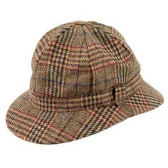 A traditional outdoor hat made in the UK from a locally woven British Wool tweed.The distinctive shape of the ghillie is similar to the deerstalker but without ear flaps.It features a peak at the front and back to keep the sun (or rain) off your face and neck.It can also be bent in half at the middle without damage to easily fit into your pocket.Our ghillie hats have been expertly made entirely in the North of England from the highest quality materials - a 100% British Wool tweed woven in our lo Tweed Hat, Outdoor Hat, Indoor Outdoor Slippers, Hunting Hat, Hat Organization, Country Wear, Bowler Hat, Outdoor Slippers, Outdoor Hats