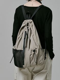 This is a casual and comfortable sling bag that is made out of high quality polyester and nylon 100% fabric. With design detail of logo print on the back and detachable shoulder strap, it gives a trendy and casual mood.- 2-way styling as a backpack or sling bag- Front water resistant zipper- 3M elastic string and 3M logo print Teach Wear, Running Backpack, String Backpack, One Strap Backpack, Techwear Fashion, Pet Bag, Sling Bags, String Bag, Cross Bag