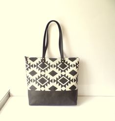 Large leather and woven cotton aztec tribal geometric pattern printed shoulder zippered tote bag with real leather handles. Office work laptop bag, school book bag, travel, sport, weekender bag * Exterior: - Top part: high quality durable woven cotton fabric with black aztec tribal geometry pattern print. - Bottom: high quality buttery soft vegan faux leather in charcoal gray * Interior: gray cotton lining * Six slip pockets inside with different size to help you organise your stuff * Additional Black Geometric Bag For Everyday Use, Black Geometric Shoulder Bag For Everyday Use, Black Bag With Geometric Pattern For Daily Use, Everyday Geometric Bag With Removable Pouch, Geometric Bag With Removable Pouch For Everyday Use, Black Bags With Geometric Pattern For Daily Use, Everyday Geometric Bag With Adjustable Strap, Trendy Geometric Bag For Everyday Use, Trendy Geometric Bags For Everyday Use