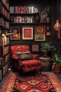 a red chair sitting in front of a bookshelf filled with lots of books