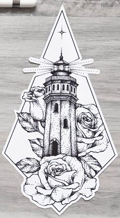 a sticker with an image of a lighthouse and roses in the center on a piece of wood