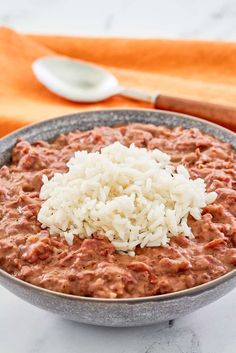 a bowl filled with rice and red beans