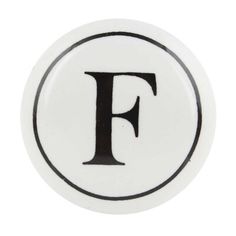 a black and white letter f on a white button with the word f in it