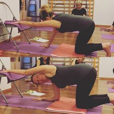 a woman is doing yoga on her pink mat