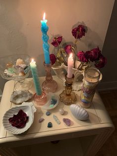 a table topped with candles and other items