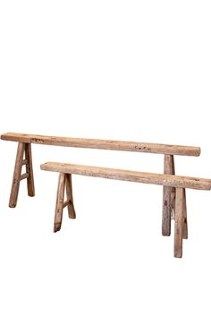 two wooden benches sitting next to each other