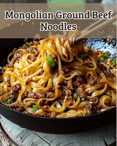 a pan filled with noodles and ground beef