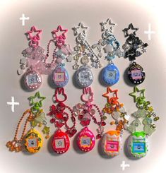 a bunch of key chains that are all different colors and shapes, with numbers on them