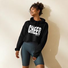 A simple, classic cheer sweatshirt made with an extremely cozy cotton/poly blend. You will not want to take it off. Wear to school, practice, game night or competitions.   Makes the perfect Gift for any Cheerleader or Cheer Fan! The trendy raw hem and matching drawstrings means that this hoodie is bound to become a true favorite. *Personalize with your own sport or passion in big bold letters! And if you are looking for something a little different, let us know by sending a message! * 52% airlume combed and ring-spun cotton, 48% poly fleece * Dyed-to-match drawstrings * Dropped shoulder cut * Cropped body with a raw hem This product is made especially for you as soon as you place an order, which is why it takes us a bit longer to deliver it to you. Trendy Winter Workout Hoodie, Black Sweatshirt For Cheerleading In Fall, Black Long Sleeve Cheerleading Sweatshirt, Winter Long Sleeve Tops For Cheerleading, Fall Gym Hoodie With Letter Print, Casual Hoodie With Letter Print For Cheerleading, Casual Sweatshirt For Cheerleading In Winter, Long Sleeve Winter Cheerleading Sweatshirt, Winter Workout Sweatshirt With Letter Print