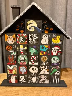 a wooden house decorated with halloween themed stickers on it's front and sides