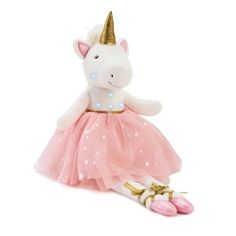 a white stuffed unicorn wearing a pink dress