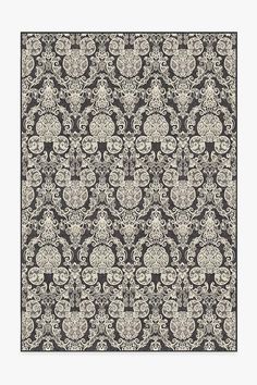 an ornate black and white wallpaper with intricate designs on the edges, in shades of gray