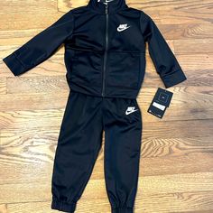 Brand New With Tags Nike Track Suit Outfit Color: Black Size: 18 Months Brand: Nike Black Winter Sports Sets, Black Cotton Playwear Sets, Sporty Black Sets For Streetwear, Casual Black Sports Sets, Sporty Black Streetwear Sets, Casual Black Sets For Sports, Casual Black Playwear Sets, Black Cotton Playtime Sets, Nike Two Piece Outfit