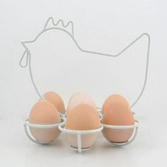 an egg holder with four eggs in it