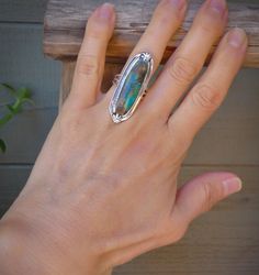 "Wear something with traditional Navajo styling! This ring is made in a timeless style with Sterling Silver and Turquoise. The Silver border detailing is absolutely astonishing and features a lovely statement. This is perfect for art lovers who appreciate handcrafted Native American made jewelry! Size 6.25 -This ring can be sized up or down within two sizes for an additional fee. Message me with questions. Setting: 1 5/8\" x 5/8\" (approx.) 12 grams Stamped: Sterling By C. Yazzie (signed) This r Handmade Turquoise Opal Bohemian Ring, Bohemian Chrysocolla Ring Jewelry, Bohemian Chrysocolla Ring, Collectible Bohemian Turquoise Ring, Mens Band Rings, Silver Turquoise Ring, Sterling Silver Rings Turquoise, Rodeo Fashion, Wide Cuff Bracelets