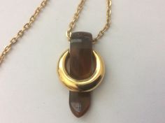 "Trifari pendant, brown plastic, gold plated metal. 1960-s Chain - 19\", magnetic clasp, chain not original. pendant size - 1 3/4\" x 1 1/16\" Very good to excellent vintage condition" Formal Gold Lucite Jewelry, Brown Bakelite Jewelry As A Gift, Brown Bakelite Jewelry Gift, Pendant With Chain, Magnetic Clasp, Pendant Necklaces, Jewelry Necklace Pendant, Gold Plate, Gold Necklace