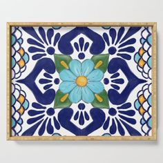 a blue and yellow floral tile design serving tray