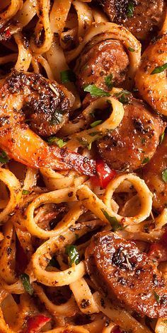 pasta with sausage and tomato sauce in a pan