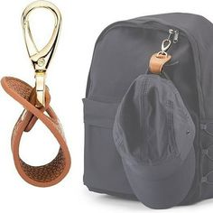 a backpack with a pair of scissors hanging from it's front and back straps