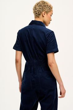 Rex Is Our Zip Front Short Sleeve Jumpsuit With A Straight Full Length Leg & Elasticated Back For Comfort. Available Here In Navy Blue! Our Fit Short Sleeve With Fixed Turn Up Fitted Bodice With Elasticated Panel At The Back Waist For Shaping Closer Fitting On The Hips With Full Length Straight Leg Standard Collar With A Zip Opening At Front Chest Pocket And Deep Hip Pockets And Back Patch Pockets The Fabric 100% Lightweight Cotton Corduroy Made From Gots Certified Organic Cotton, The Fabric Is Corduroy Jumpsuit, Short Sleeve Jumpsuit, Dungarees Shorts, Short Sleeve Jumpsuits, Jumpsuit With Sleeves, Turn Up, Tee Dress, Fitted Bodice, Hat Hairstyles