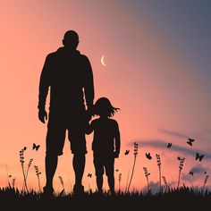 the silhouette of a father and daughter holding hands in front of an orange sky at sunset