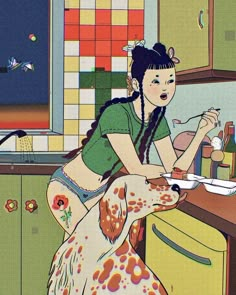 a woman is cooking in the kitchen with her dog