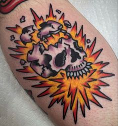 a skull with an explosion coming out of it's head on the left arm