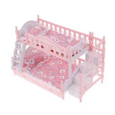 a toy bunk bed with hello kitty sheets and pink bedspreads on it's sides