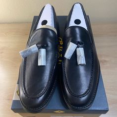 Premium Leather, Rich Lambskin Linings, And Clean, Tapered Lines. Our Luxury Take On The Iconic Penny Loafer Over-Delivers On Elegance And Comfortbecause There’s No Better Way To Honor Time-Tested Tradition. Leather Upper Slip On Entry Tassel Detailing Padded Insole Rubber Outsole Black Slip-on Tassel Loafers With Round Toe, Black Slip-on Tassel Loafers With Closed Toe, Black Tassel Loafers Slip-on Closed Toe, Black Round Toe Tassel Loafers For Business, Black Slip-on Tassel Loafers With Plain Toe, Black Plain Toe Slip-on Tassel Loafers, Black Tassel Loafers With Brogue Detailing, Black Slip-on Tassel Loafers With Rubber Sole, Black Tassel Loafers With Rubber Sole