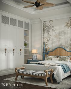 the bedroom is decorated in white and blue with palm trees on the wall behind the bed