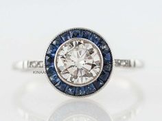 a diamond and blue sapphire engagement ring