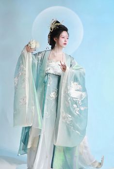 For the goddess of the moon, this gorgeous Tang Dynasty inspired set is adorned head to toe with embroideries of peonies, dragons and protection lions. Not one corner is neglected! From the wrists to the back, envelop yourself in the luxuries of high quality flowers. The Daxiushan (大袖衫, wide sleeved jacket) is dramatic and elegant, creating movement and grace with its exaggerated sleeves. A large protective lion upon the center of the jacket has got your back - literally! The star of the show is Edo Japan, Ap Portfolio, Goddess Of The Moon, Chinese Princess, Modern Hanfu, Sailor Moon Usagi, Exaggerated Sleeves, Body Figure, Tang Dynasty