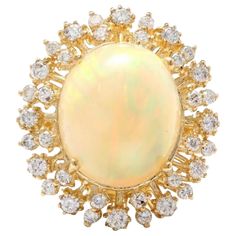 an opal and diamond broochle, by van cleef in yellow gold