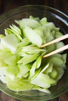 the food is prepared and ready to be eaten in the bowl with chopsticks