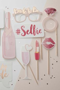 some stickers that say selfie with lipstick, lips and glasses on top of them