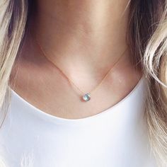 "This genuine Swiss blue topaz sits on a dainty 14k gold filled chain that lays below the collarbone. Subtle and simple, this beautiful semi-precious stone necklace is perfect by itself or for layering with other necklaces. Blue Topaz is the birthstone for December and would make a beautiful birthday gift. All necklaces are handmade by me in NYC using only the highest quality materials and handpicked genuine gemstones. Each necklace is finished with a tiny pearl at the ending of each chain near