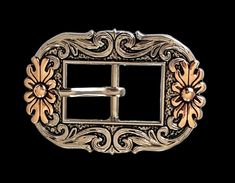 "Floral 2-tone Cart Buckle is plated in copper and nickel with black enamel was to accentuate the design. Fits a 3/4\" strap. Overall size is 2 1/2\" x 1 3/4\"." Gold Concho Belt Buckle For Formal Occasions, Adjustable Engraved Gold Belt Buckles, Silver Hand Tooled Adjustable Belt Buckles, Adjustable Silver Hand-tooled Belt Buckles, May 23, Black Enamel, Fort Worth, Fort, Copper