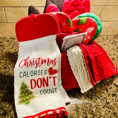 christmas towels and mitts are on the counter